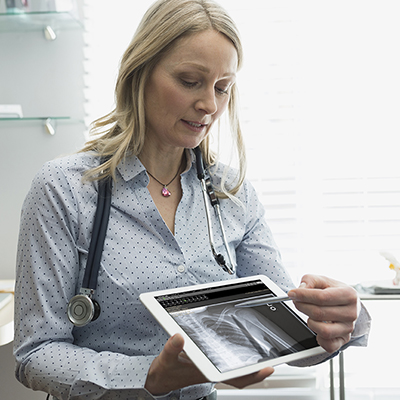 Doctor presenting a medical information using her tablet